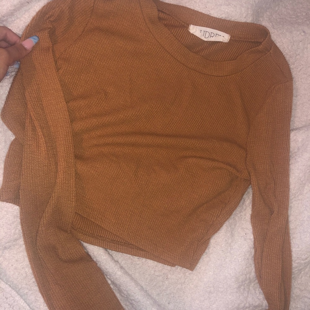 Two cropped sweater tops